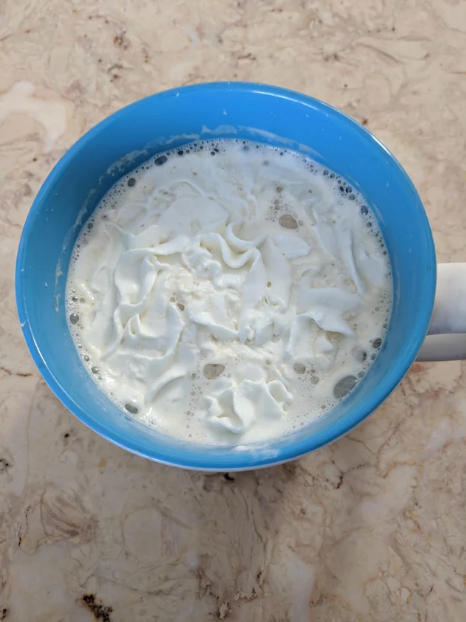 whipped cream in a coffee cup