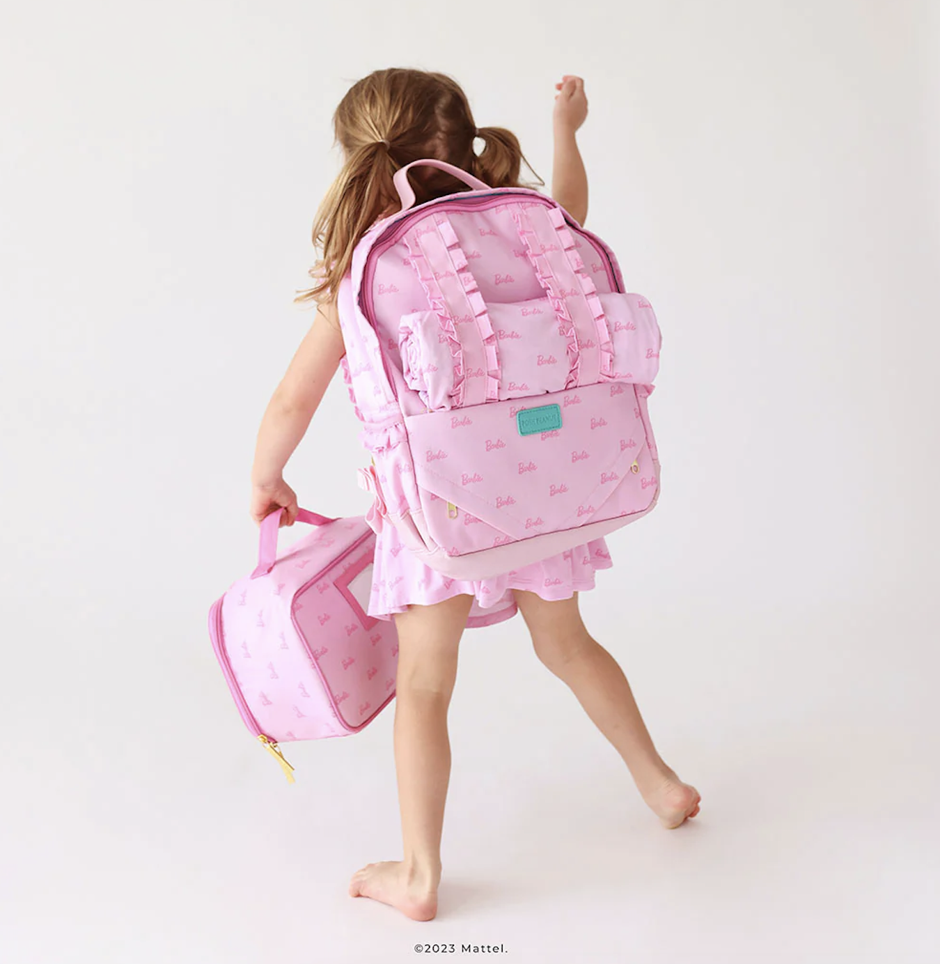 girl with barbie backpack on