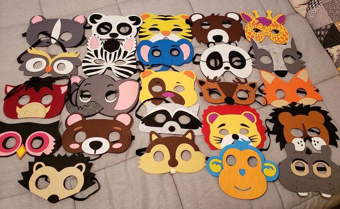 Reviewer&#x27;s image of of felt animal masks atop a bed
