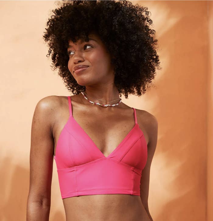 A pink longline triangle bikini top