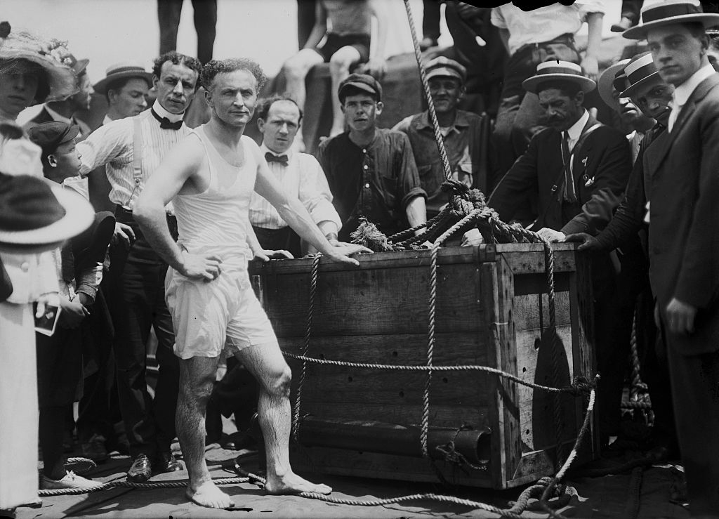 houdini next to a crowd of people