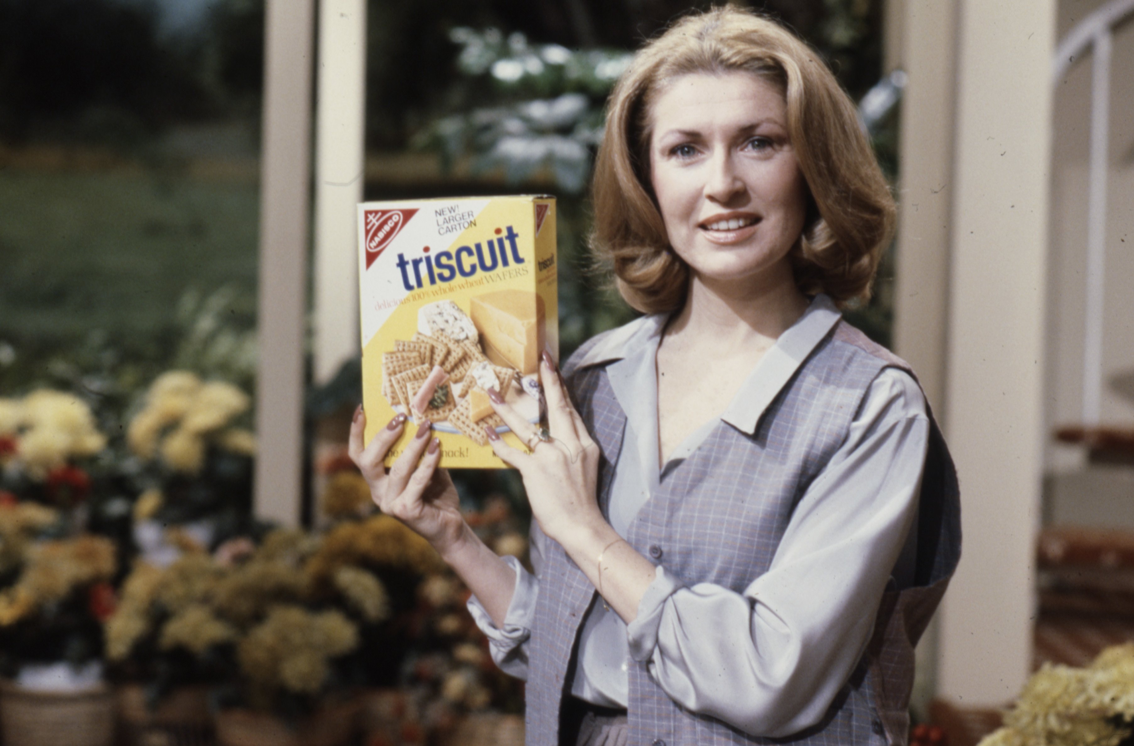 woman holding triscuit box