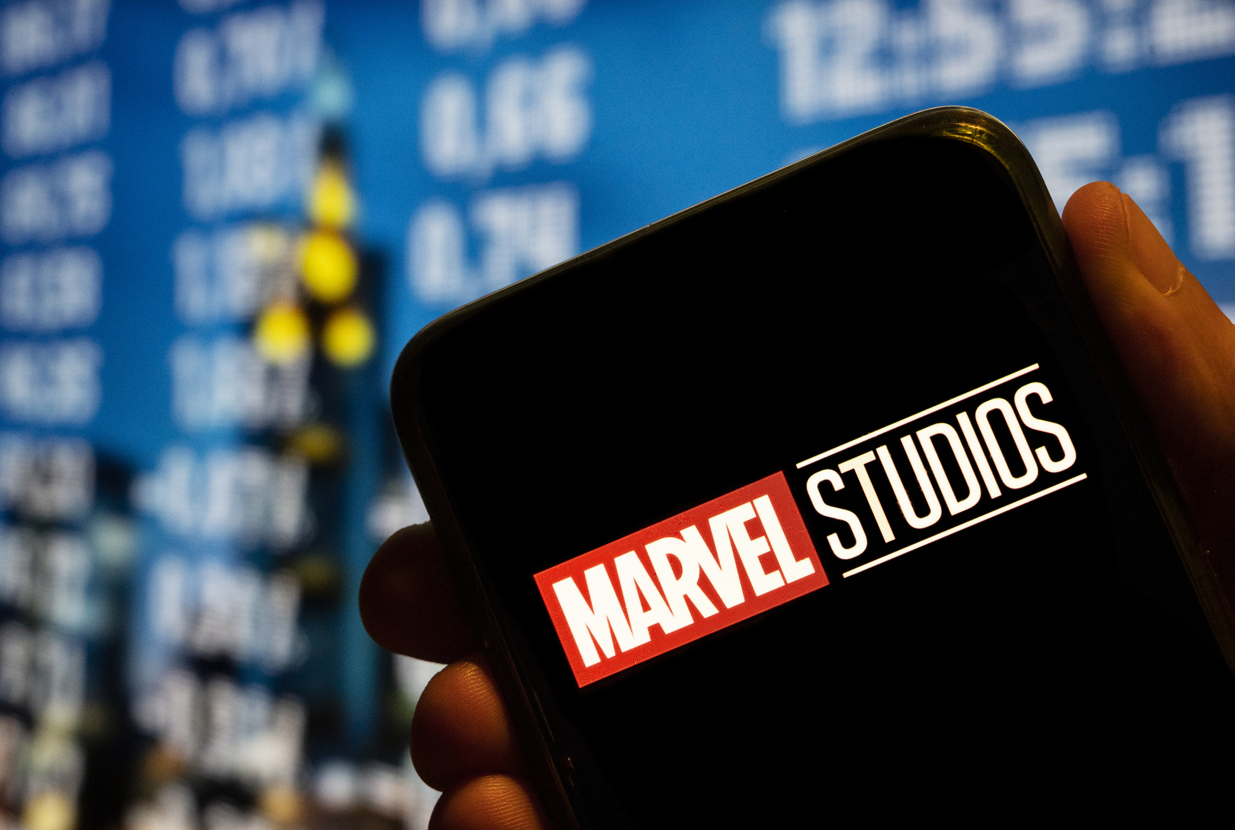 Marvel Studios logo on a phone at a Marvel event