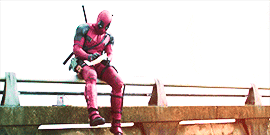 Deadpool sitting on a bridge and drawing comic book style moments