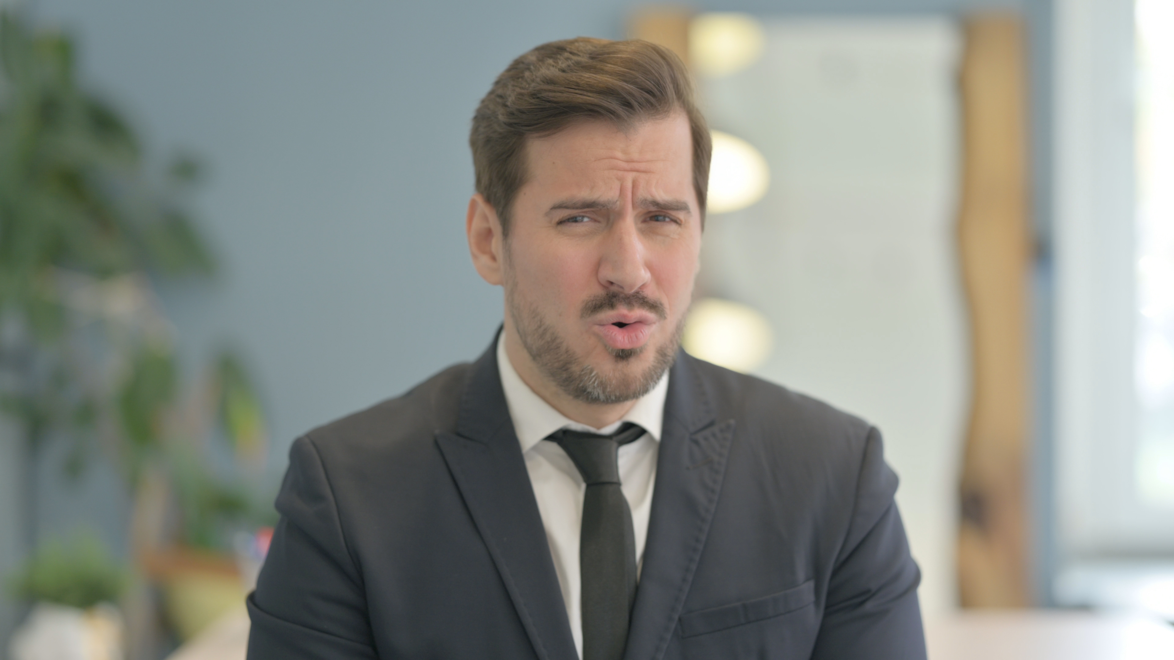 A man making an "oooh" face