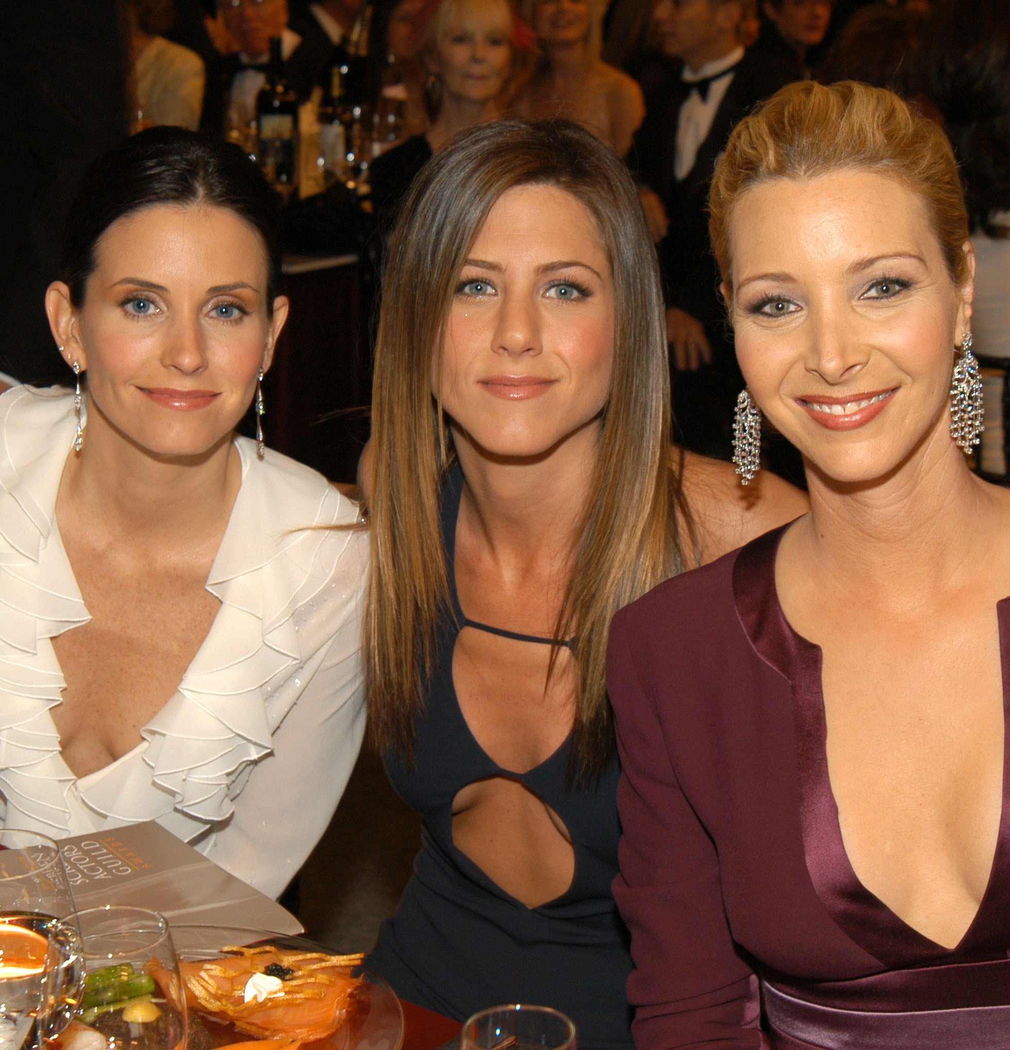 Closeup of Courteney Cox, Jennifer Aniston, and Lisa Kudrow