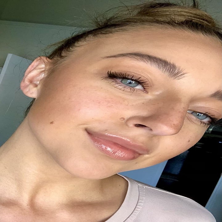 reviewer wearing the stone colored gloss