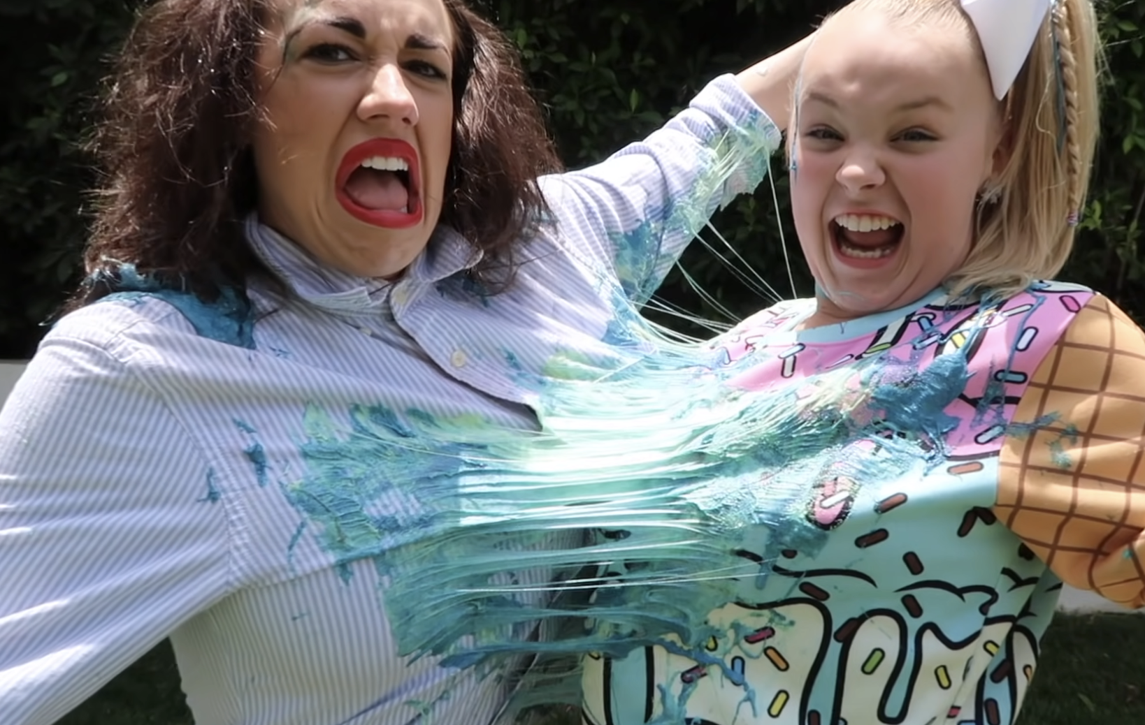 Miranda Sings and JoJo Siwa stuck together with slime