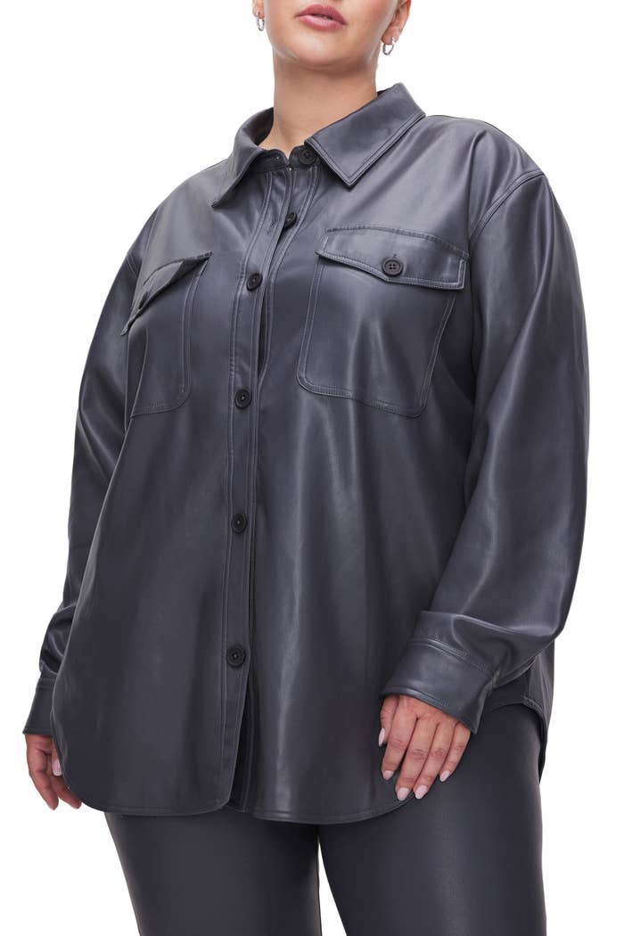 model in black button-up faux leather shacket