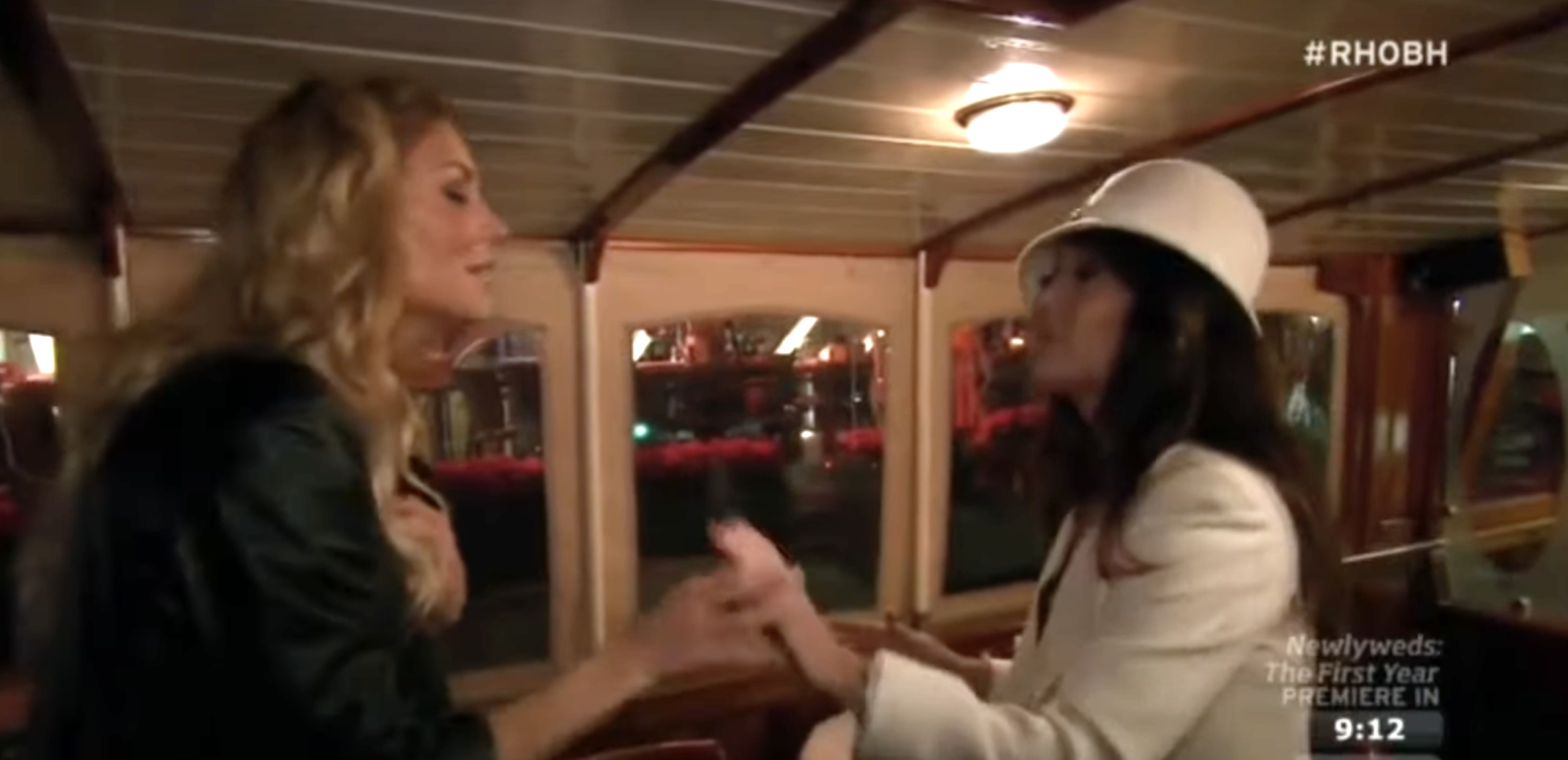 two women talking on a boat