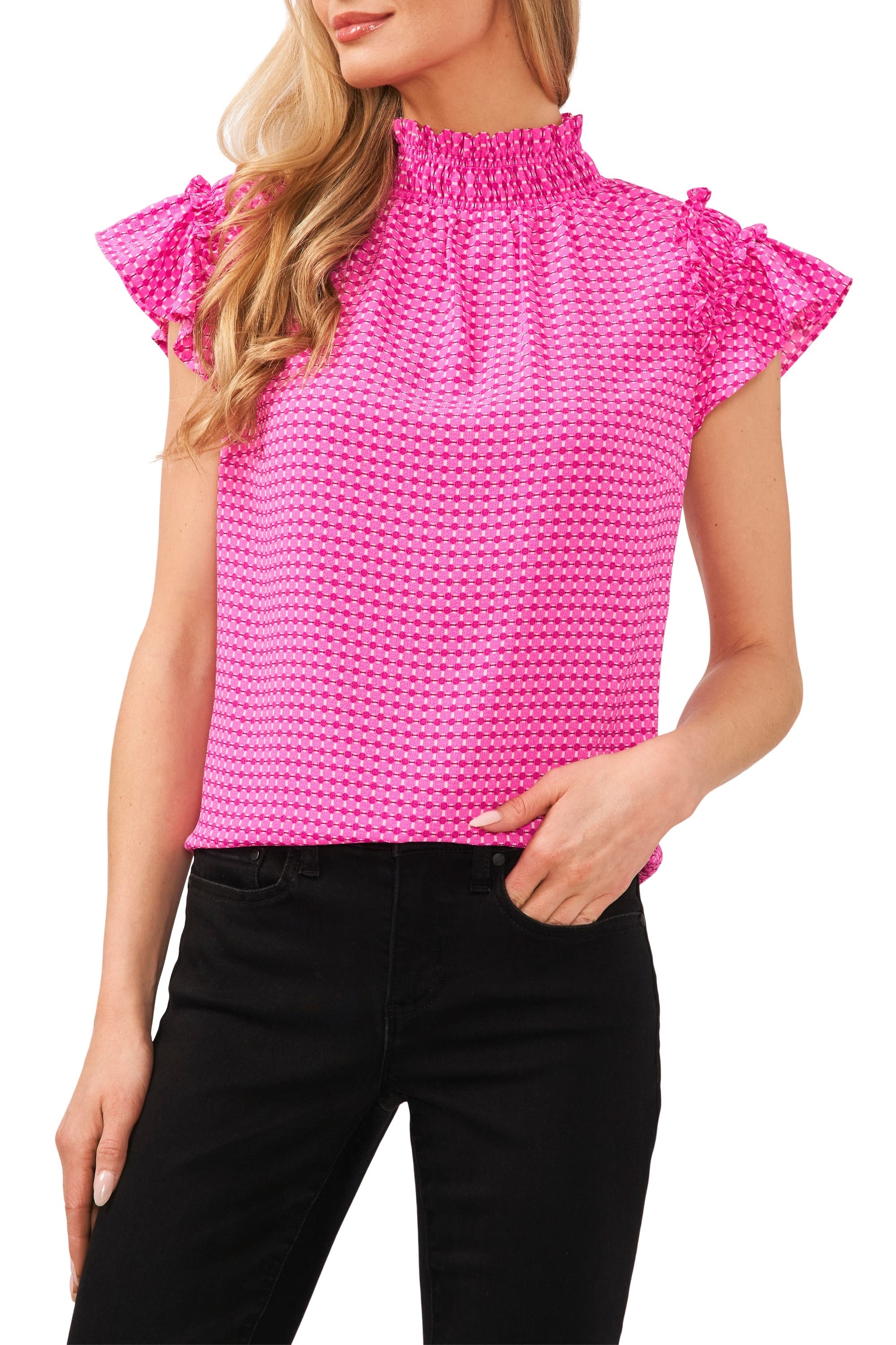 model in hot pink tank with a smocked mock neck and short flutter sleeves