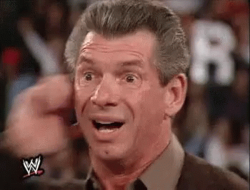 Vince McMahon pulls his ear out of confusion