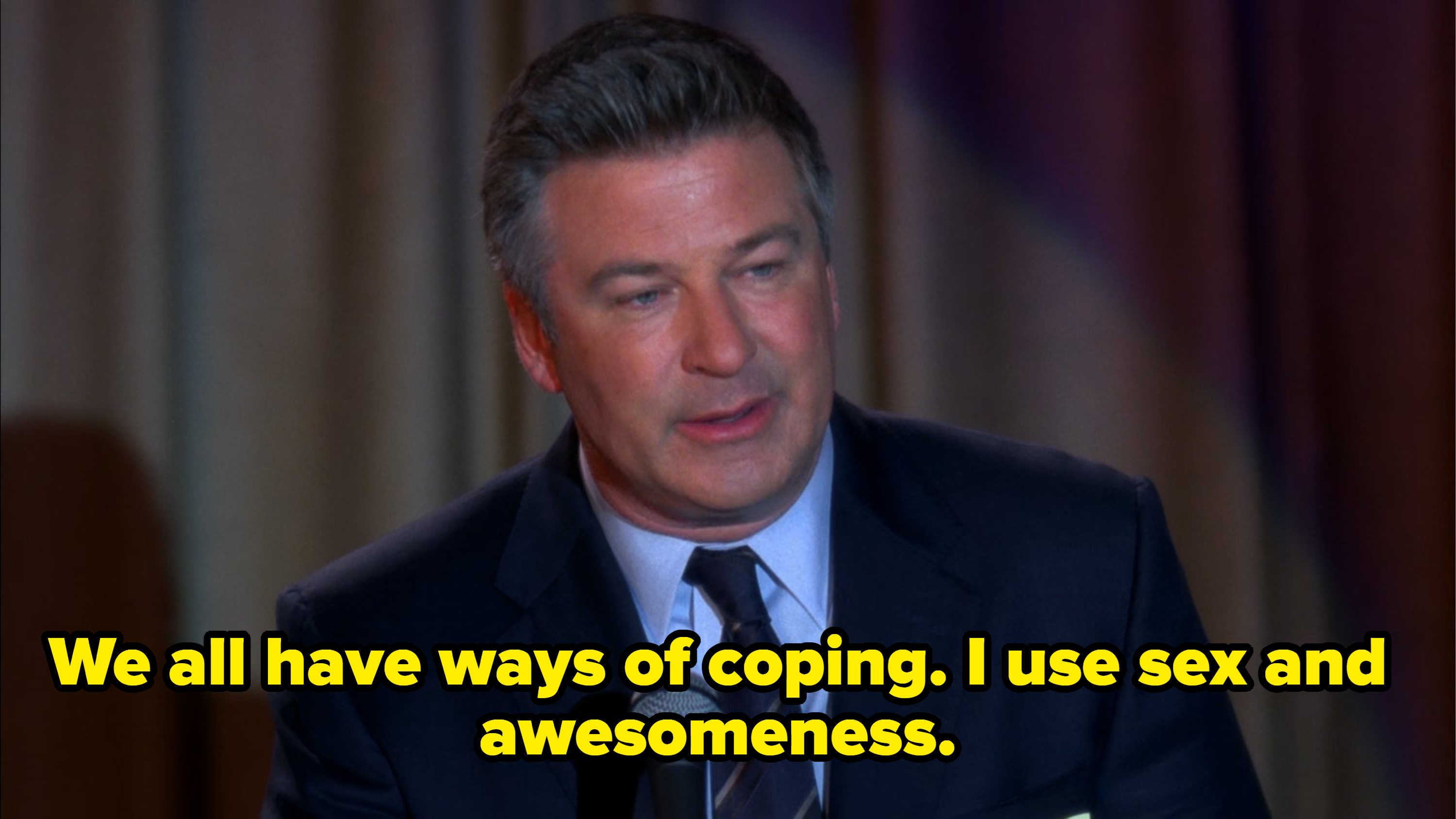 Alec Baldwin speaks on stage