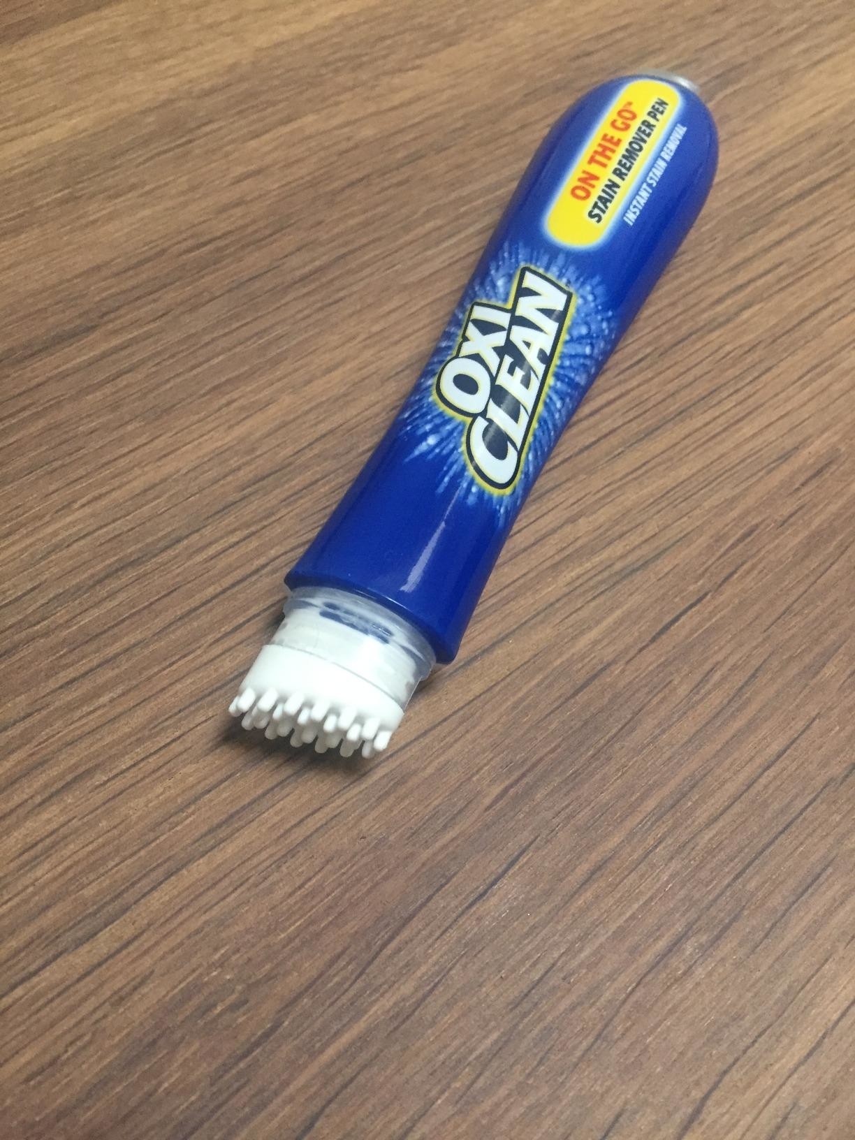 Reviewer&#x27;s photo of the OxiClean pen with the cap off to show its scrubbing tip