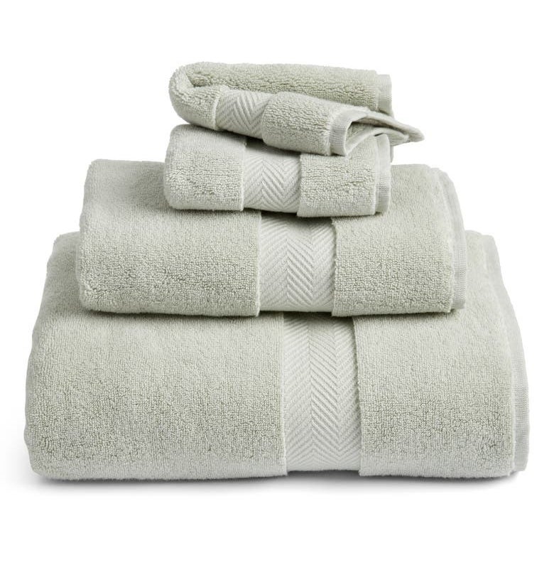 folded green bath towels