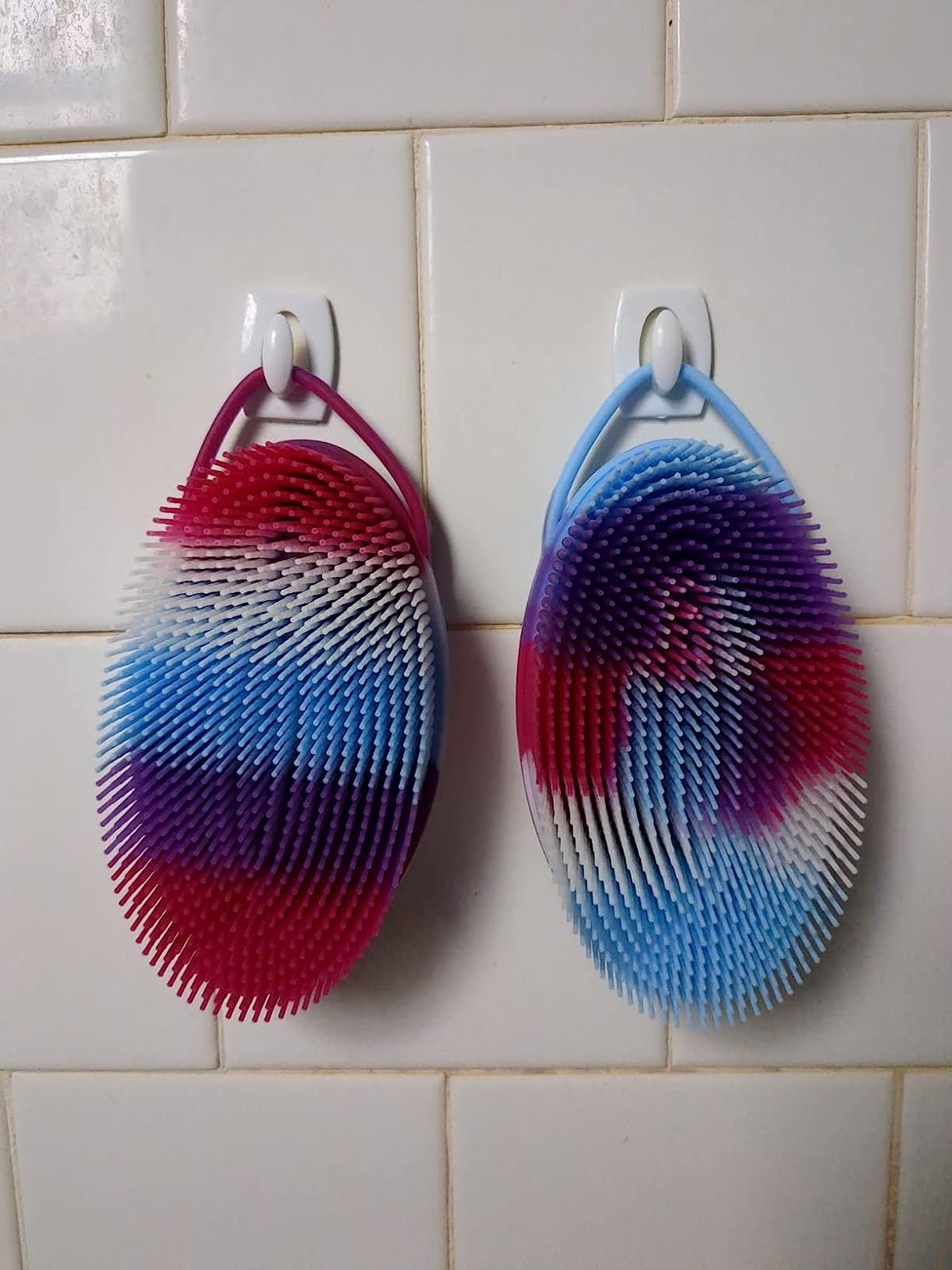 Reviewer image of the brushes hanging up in their shower