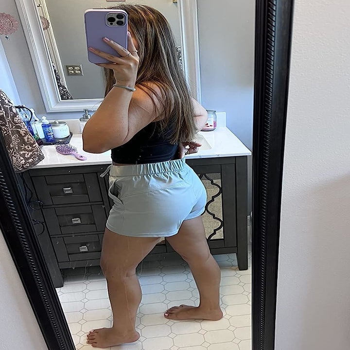 Image of reviewer wearing gray shorts