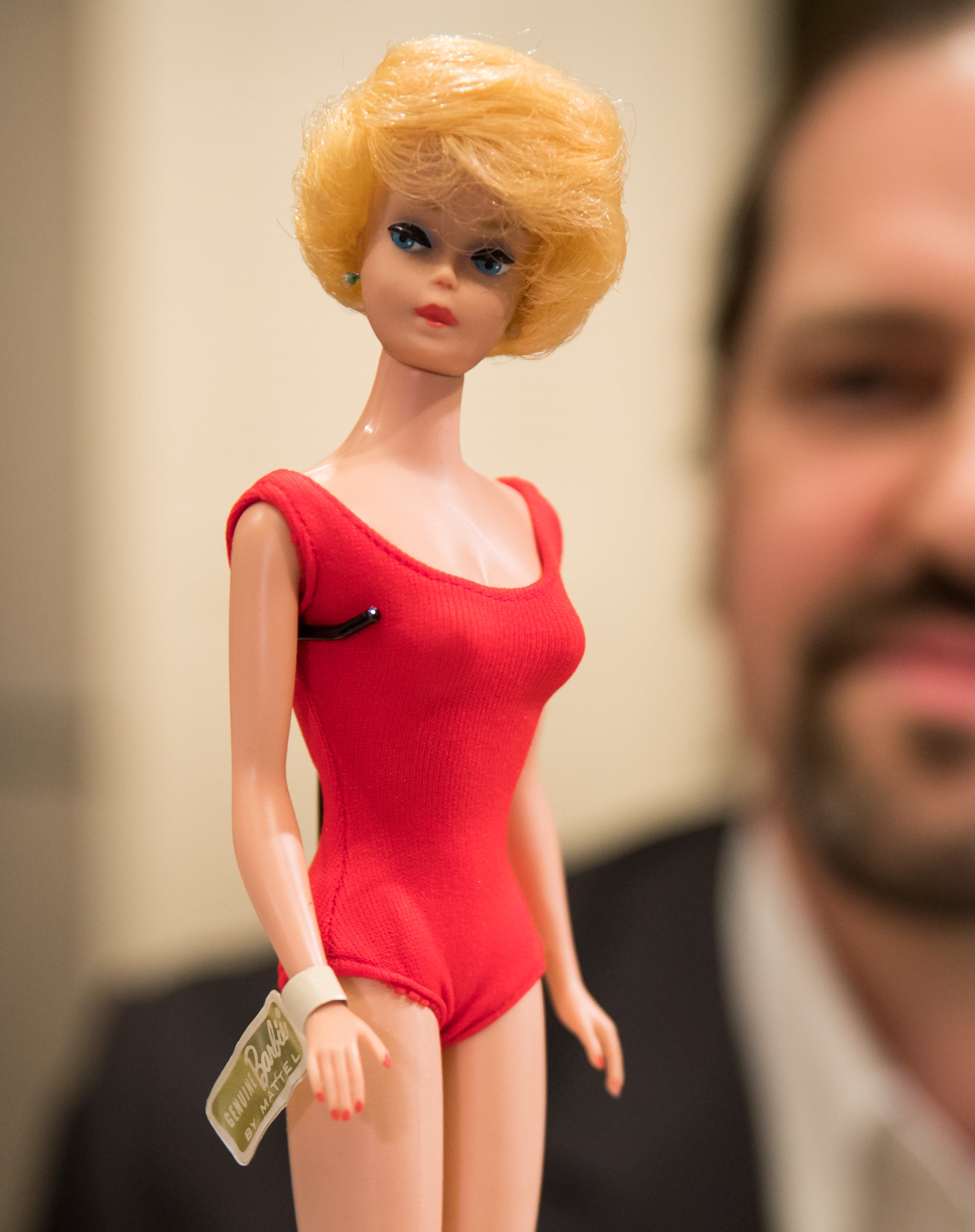 Professor of Chemistry Jens Pesch looks at a historical Barbie doll from 1962 at the toy museum in Nuremberg, Germany, 24 February 2017