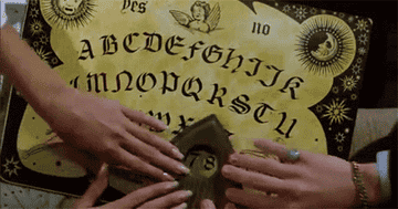 People using a Ouija board