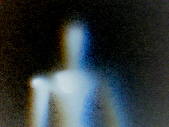 A ghostly, blurry figure with different color highlights