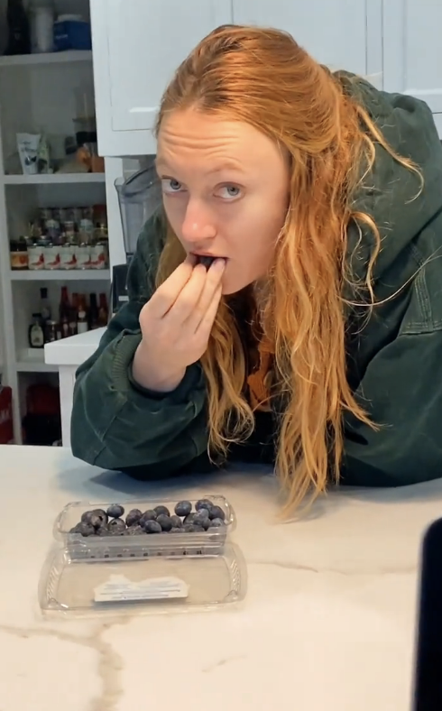 Closeup of Jacqueline Emerson eating berries