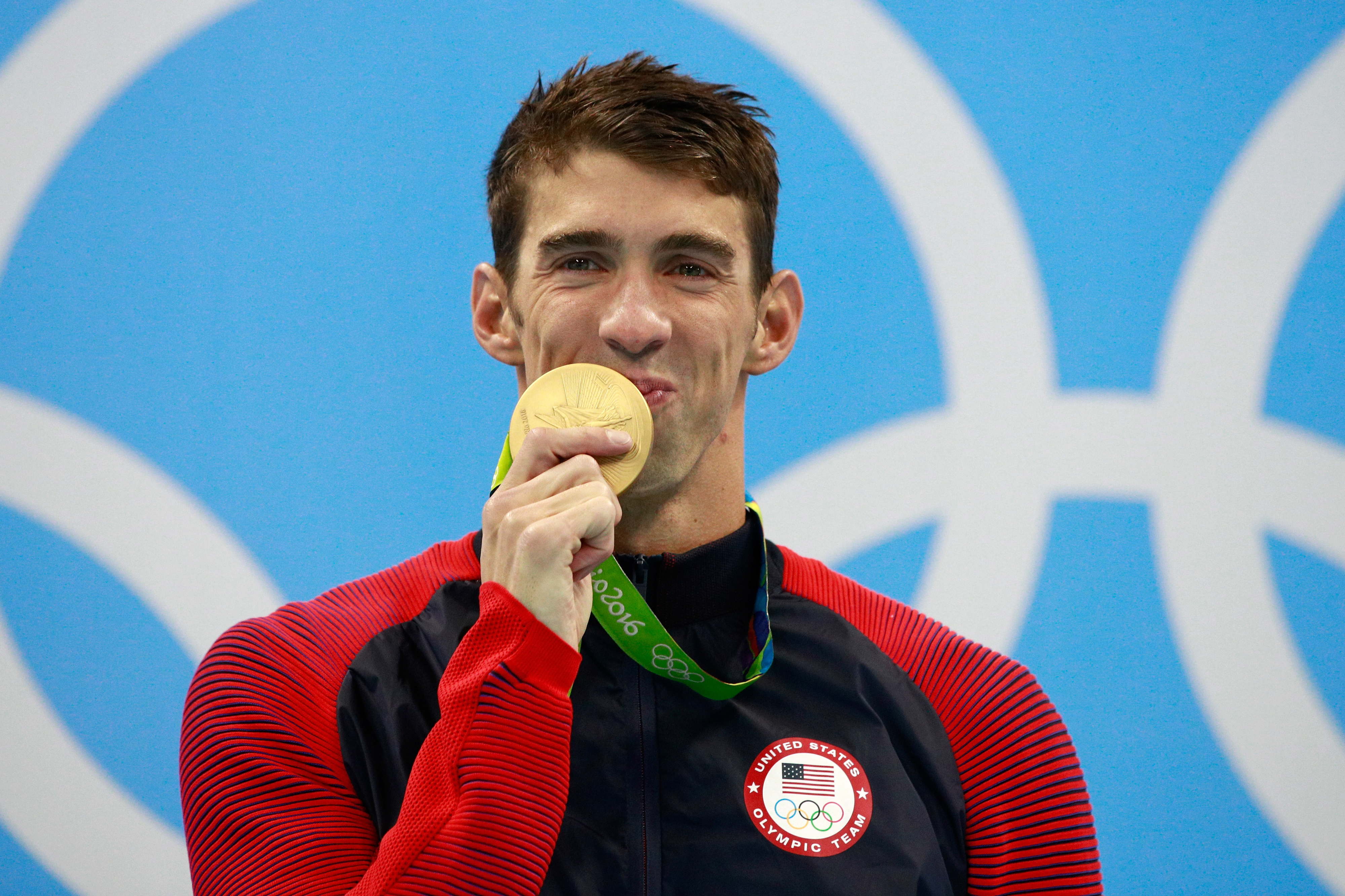 Closeup of Michael Phelps with his gold medal