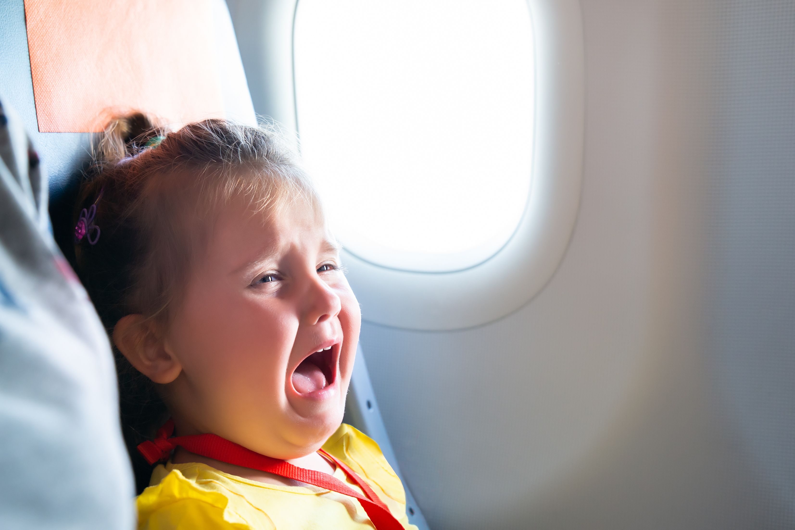 child crying on flight
