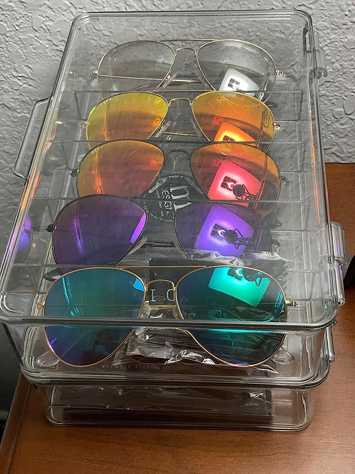 Reviewer image of their sunglasses stored in the acrylic organizer