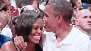 Barack Obama kissing Michelle on the forehead