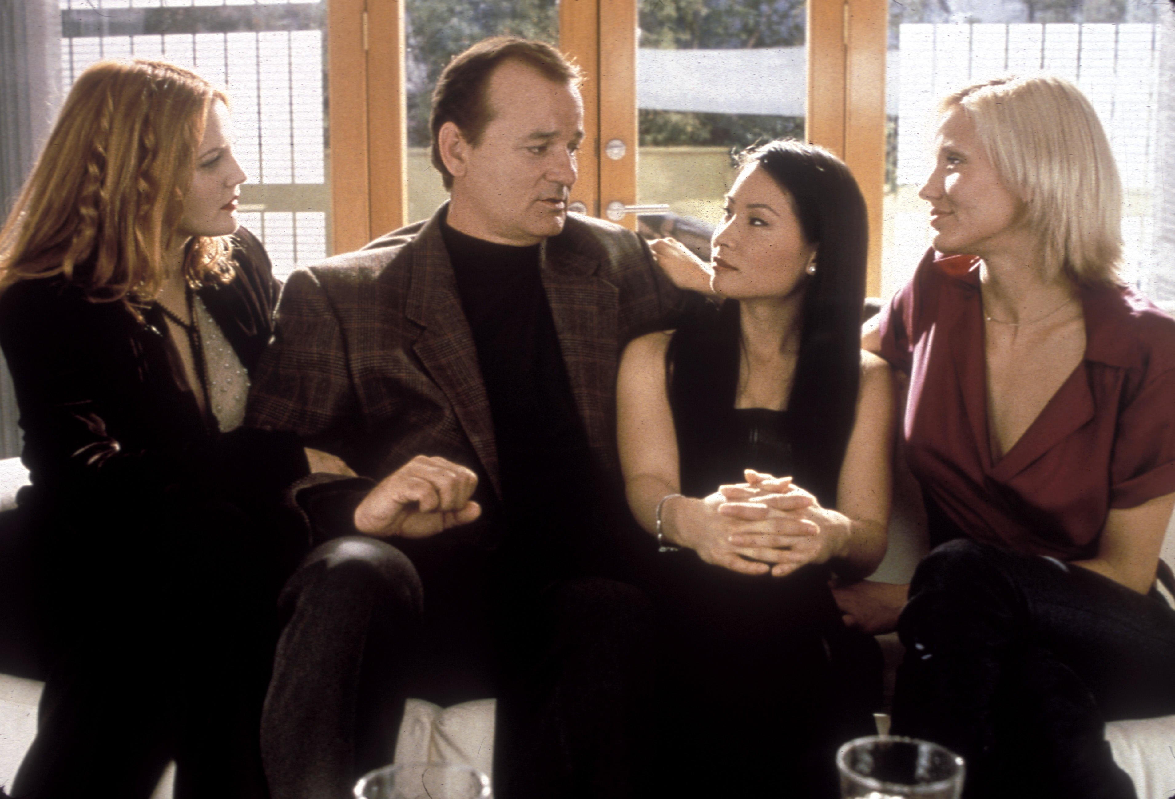 Bill Murray sits with Drew Barrymore, Lucy Liu and Cameron Diaz in a scene from Charlie&#x27;s Angels