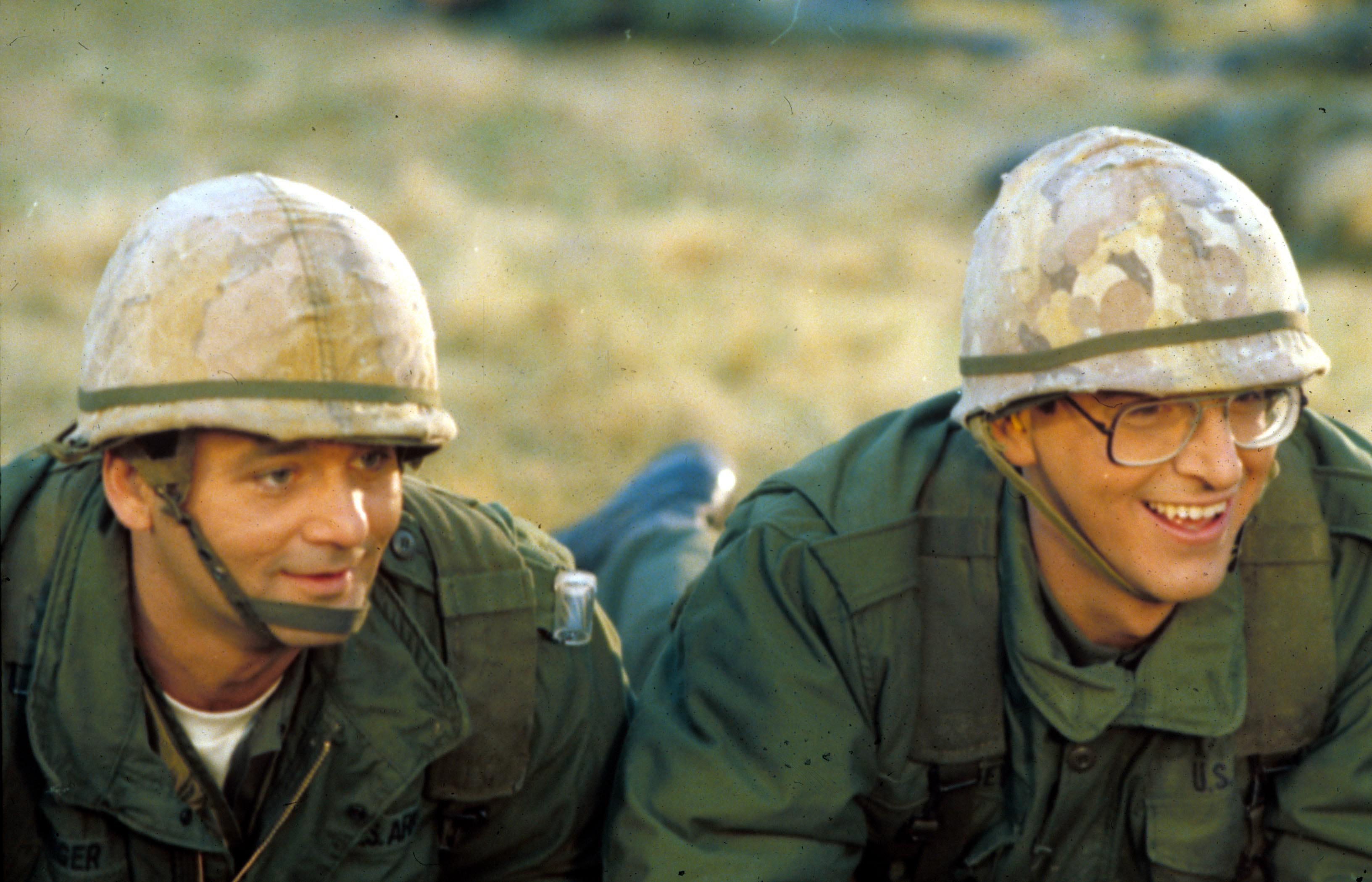 Bill Murray and Harold Ramis lay down in army gear