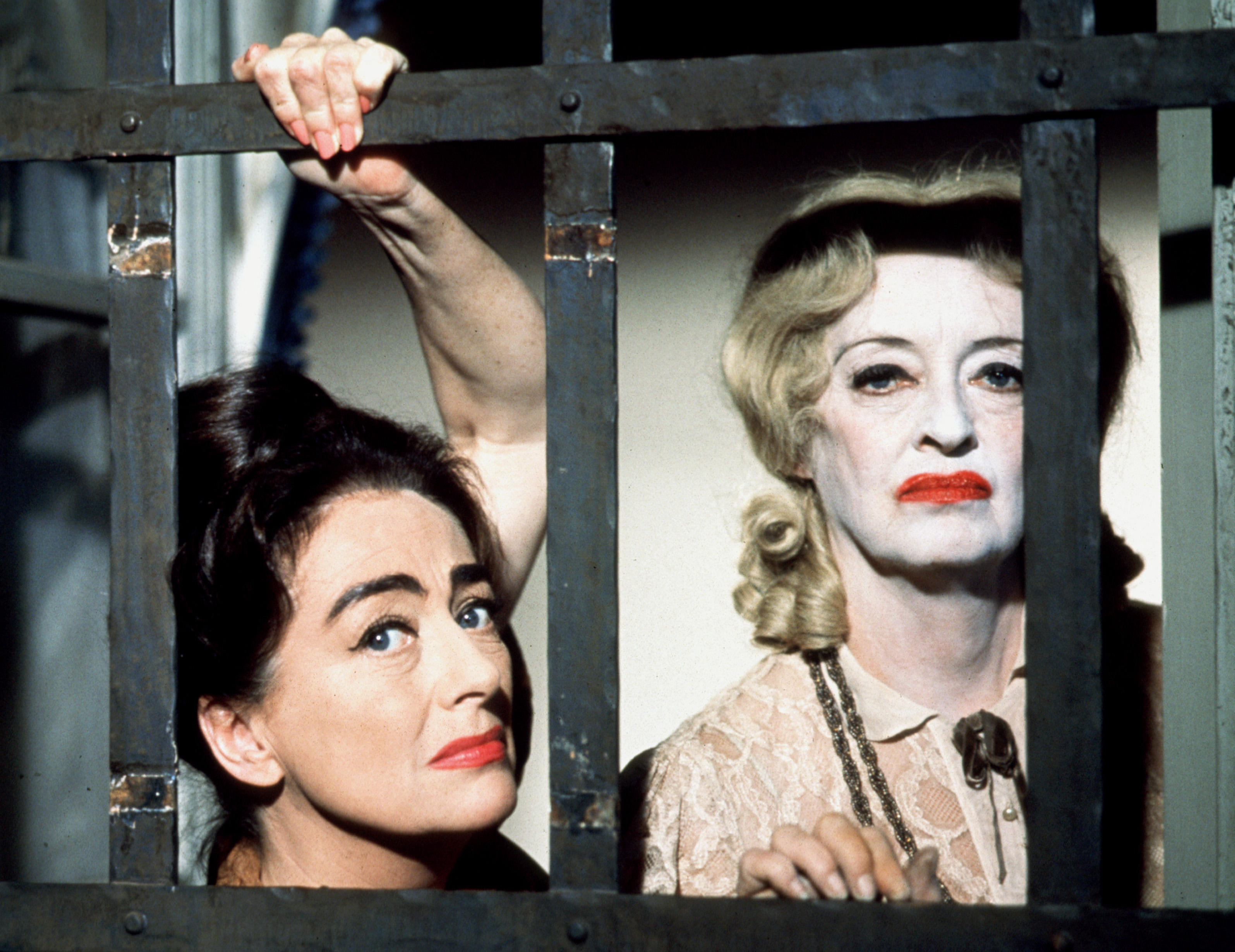 Bette Davis and Joan Crawford look through bars in &quot;What Ever Happened To Baby Jane?&quot;