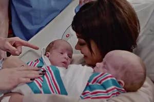 haley dunphy from modern family holding twin babies