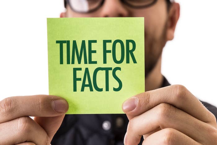 Man holding up a &quot;Time for Facts&quot; label