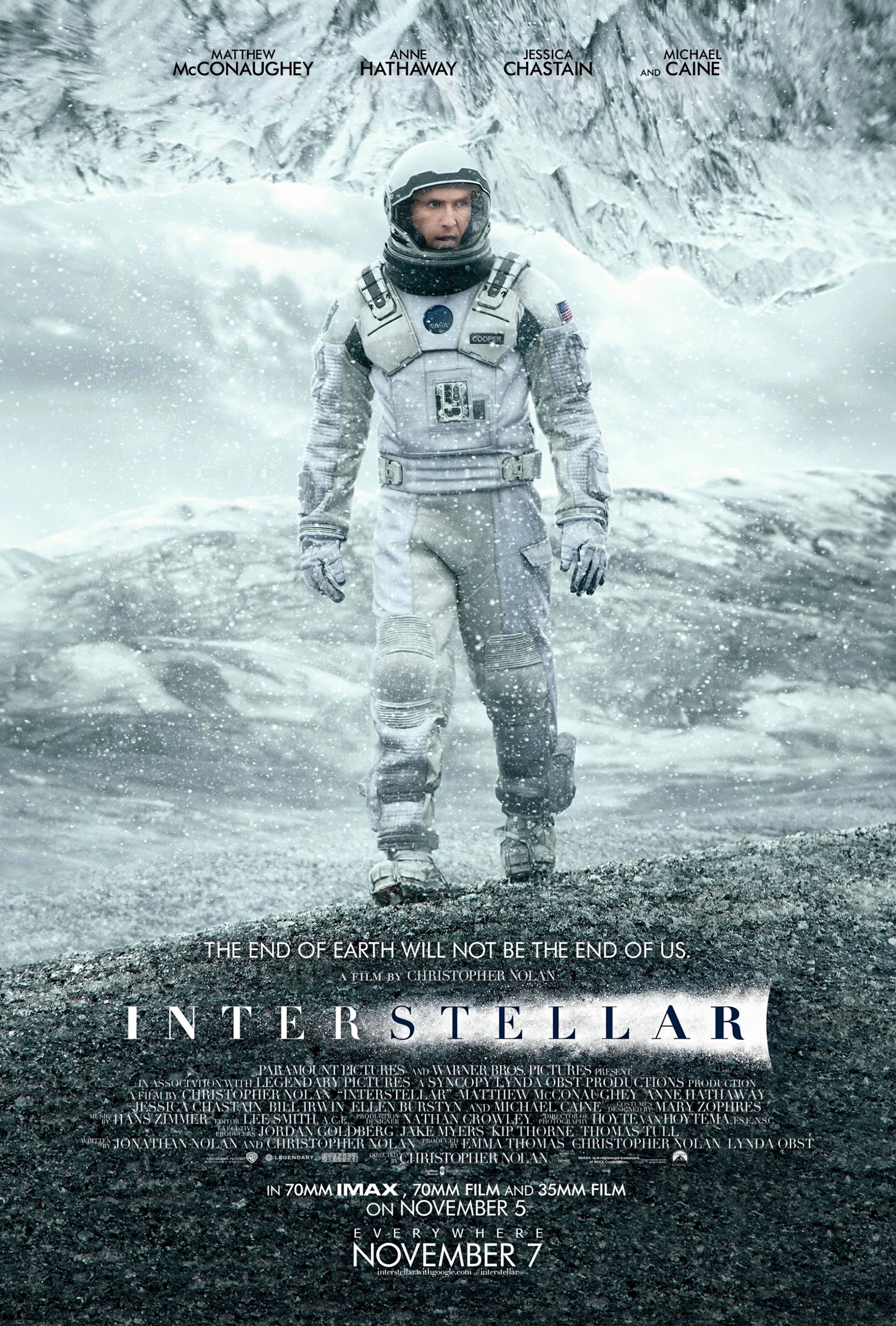Astronaut Matthew McConaughey stands in the center of a white landscape on the Interstellar movie poster.