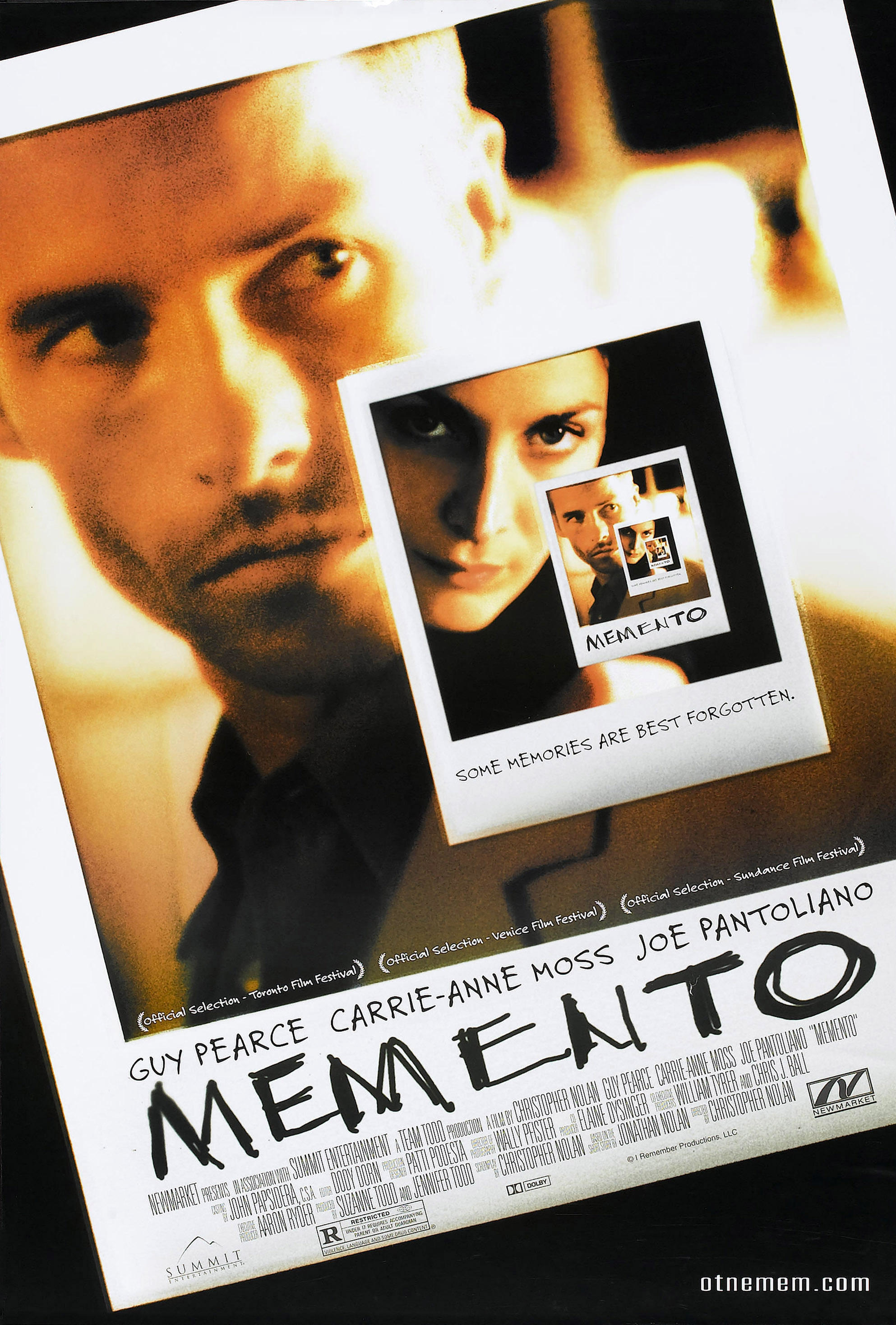 The Memento movie poster features Guy Pearce and Carrie-Anne Moss on Polaroid photos.