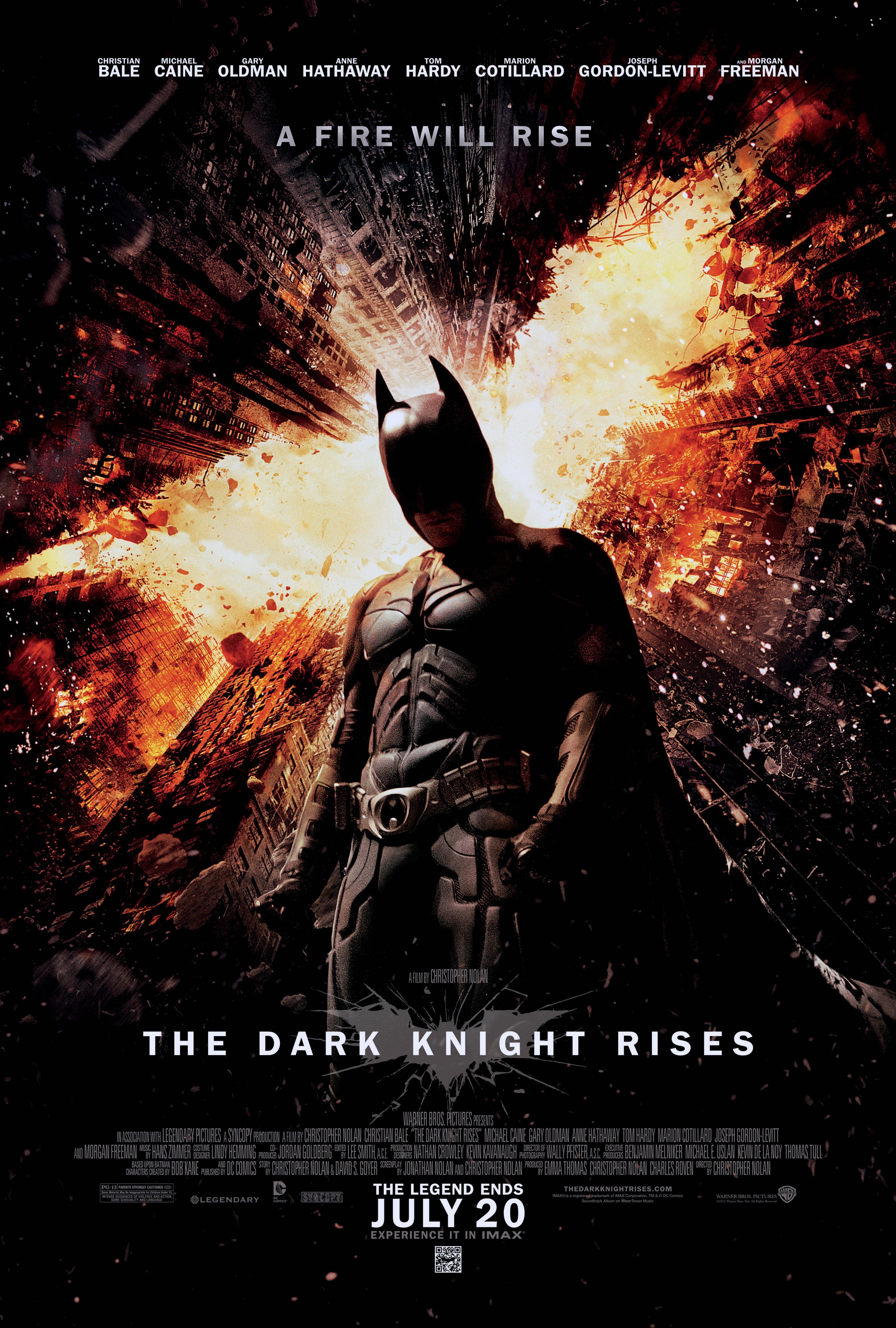 Batman stands in the center of a fiery cityscape on The Dark Knight Rises movie poster.