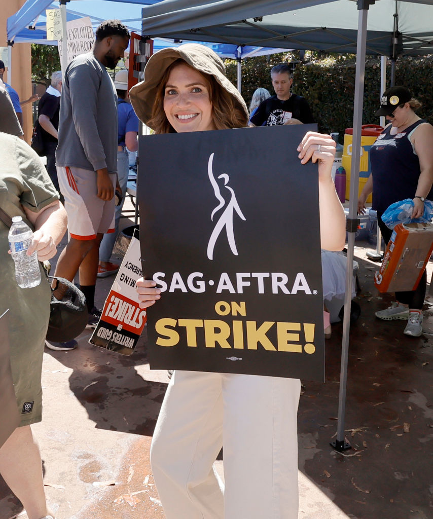 Mandy Moore holding a picket sign