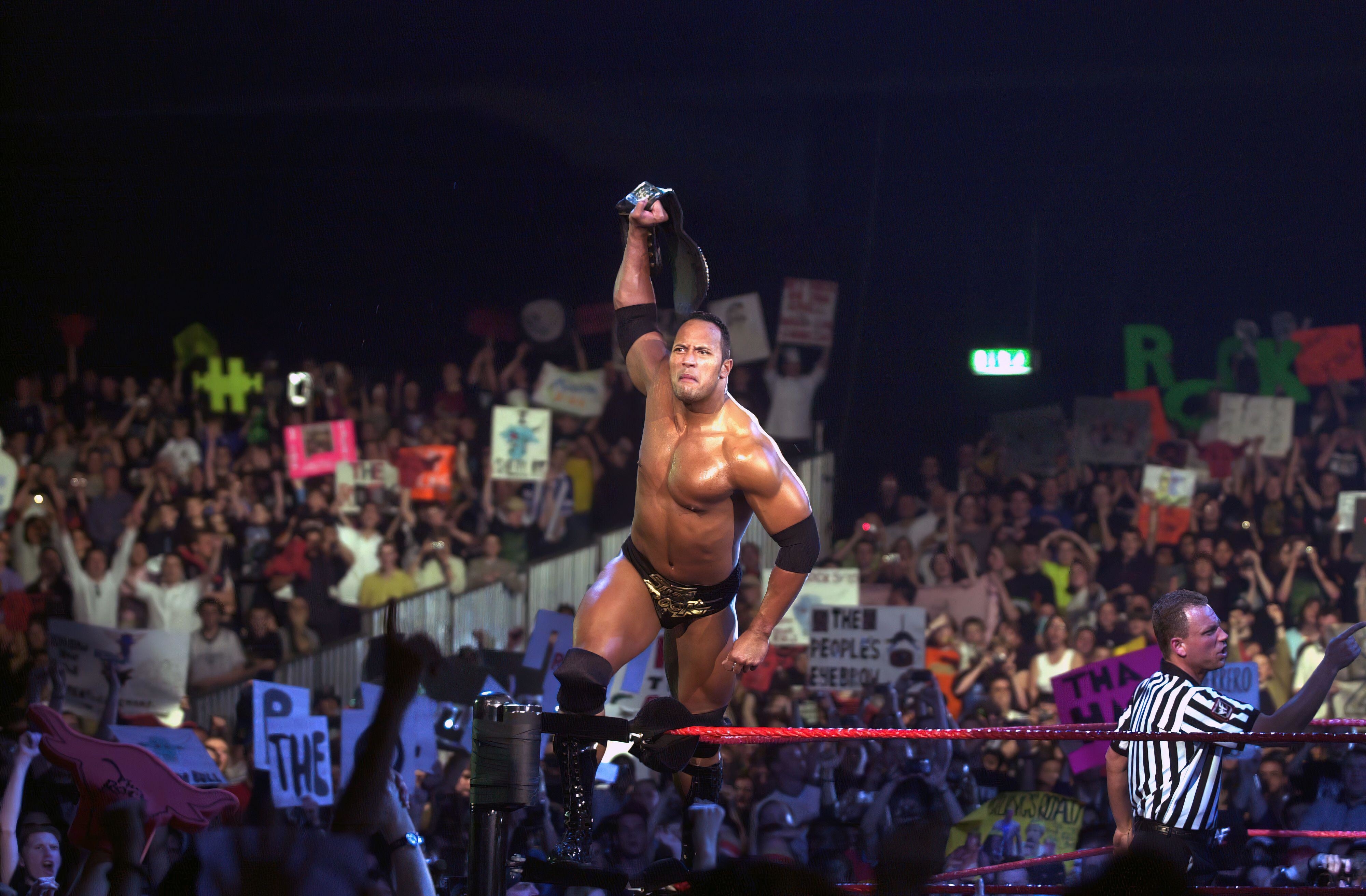 The Rock celebrates his win over Triple H on WWE&#x27;s First Ever British Tour