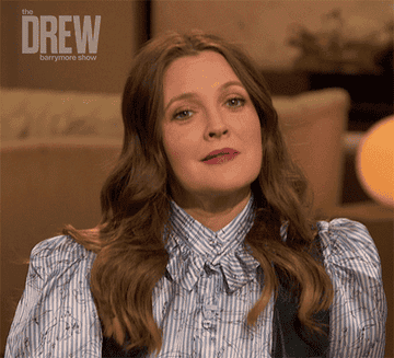 Drew Barrymore points and nods in agreement
