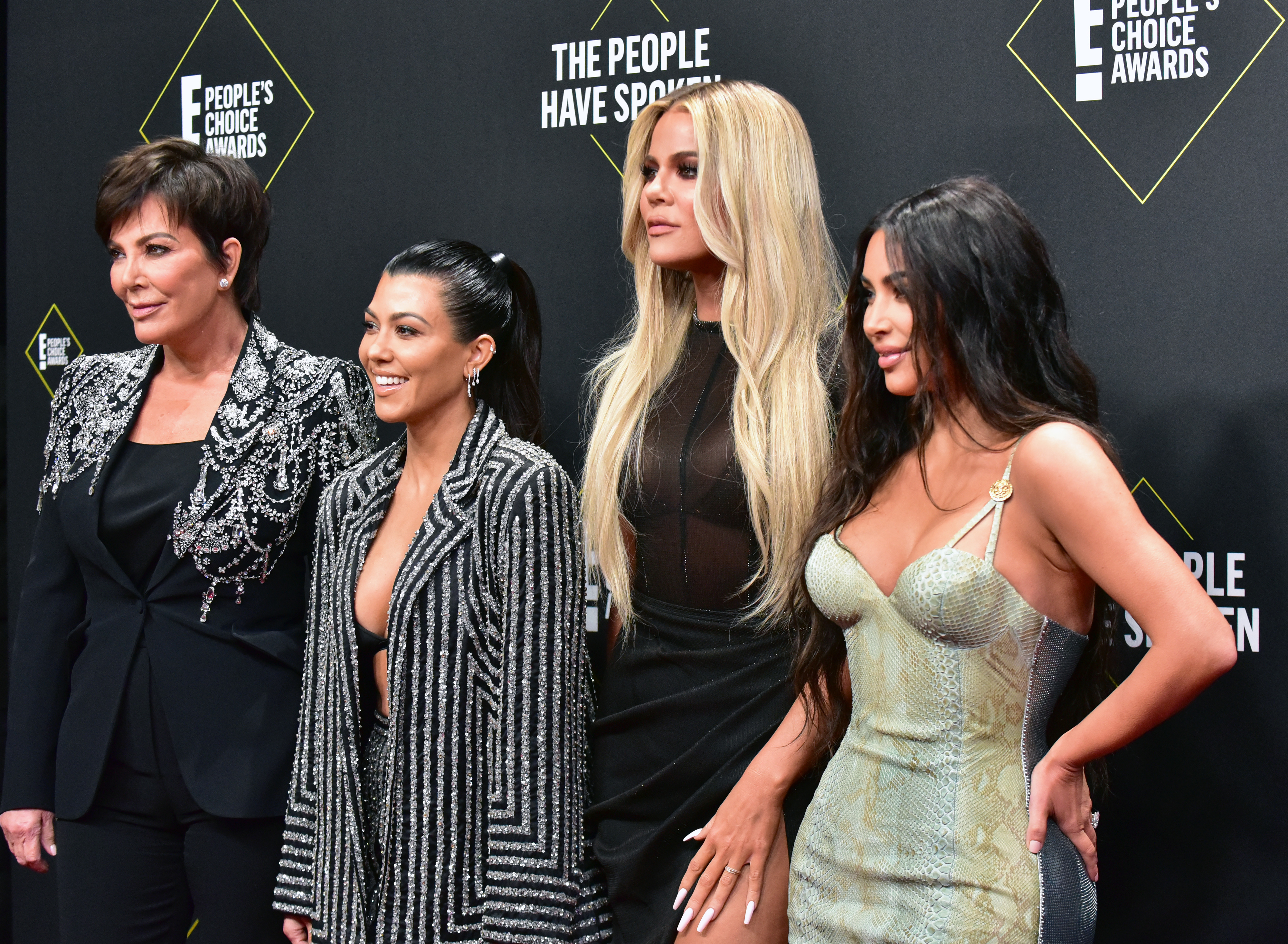 Kris Jenner and Kourtney, Khloé, and Kim Kardashian at a media event
