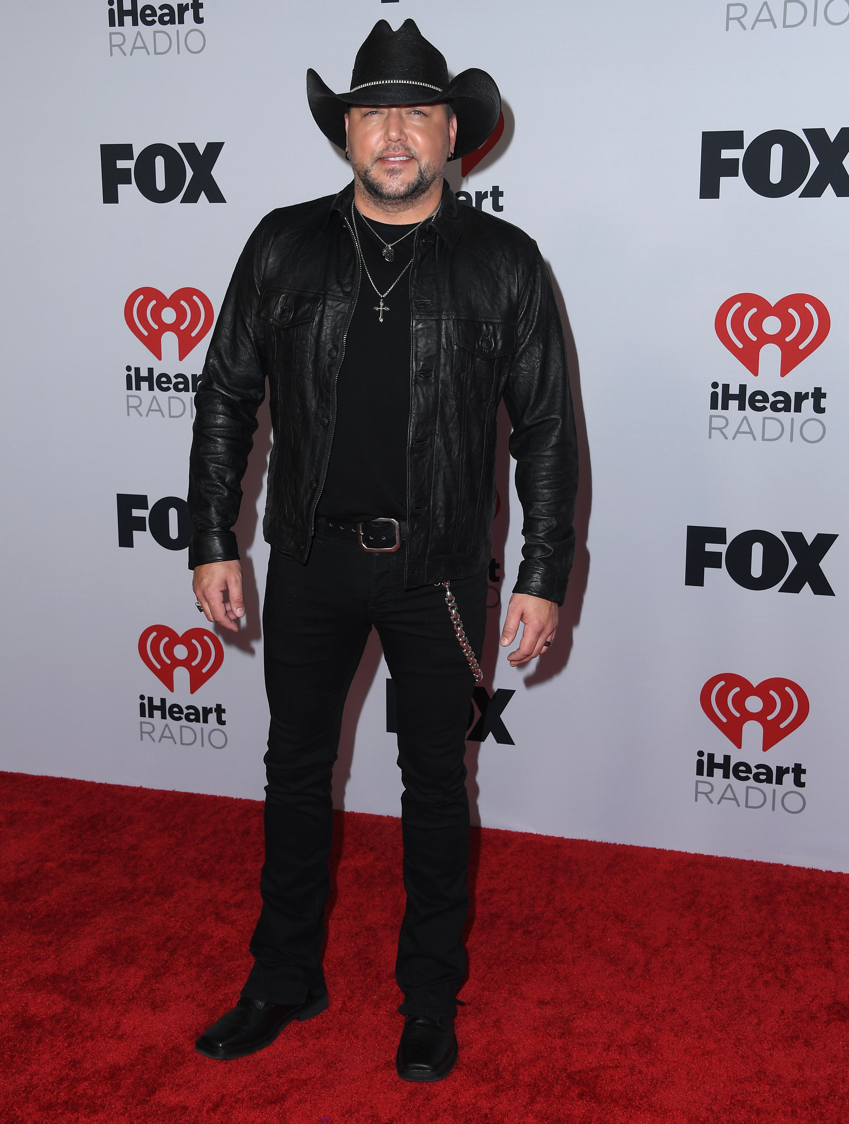 Jason Aldean on the red carpet in a cowboy hat