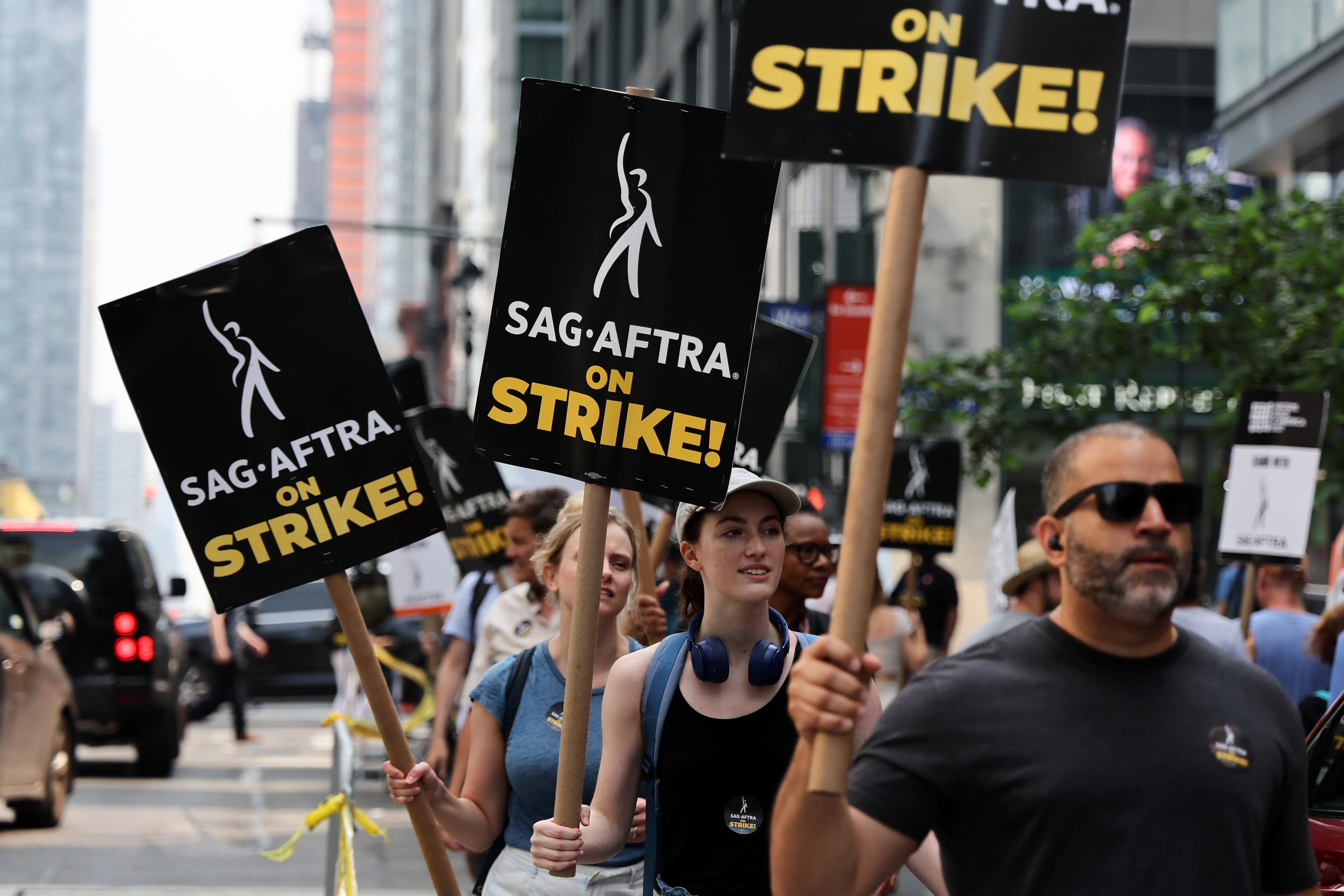 A group of protestors holding signs that say SAG AFTRA on Strike