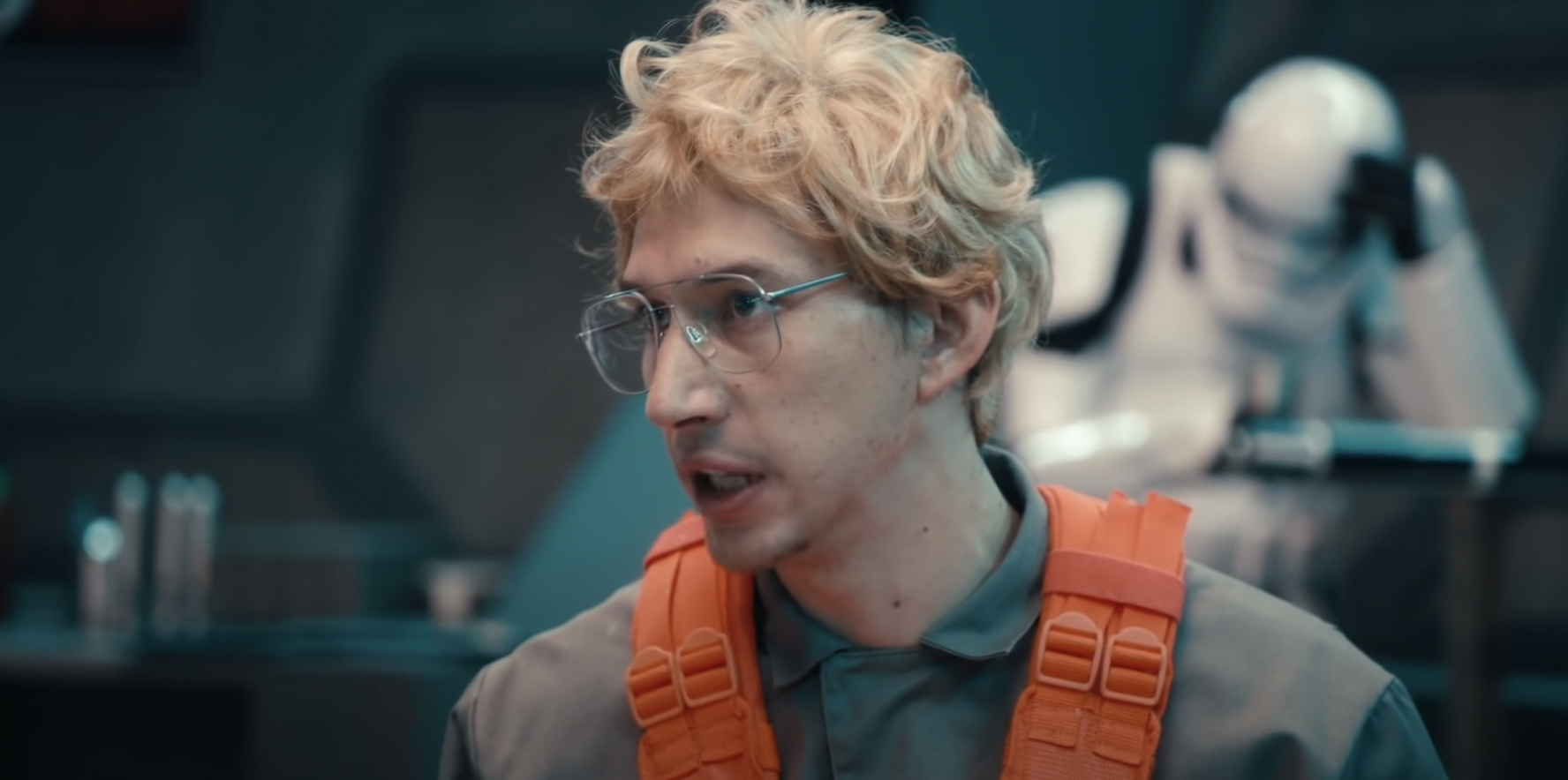 Adam Driver dressed in a wig and glasses