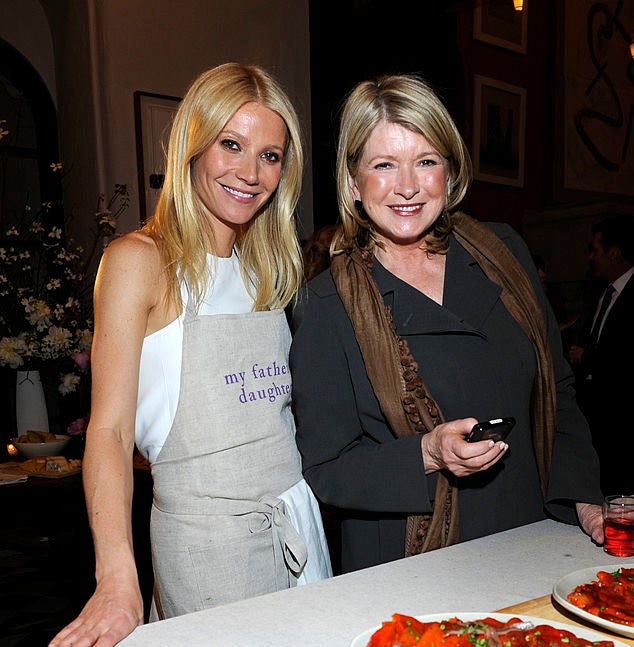 the two at an event, gwyneth wearing an apron