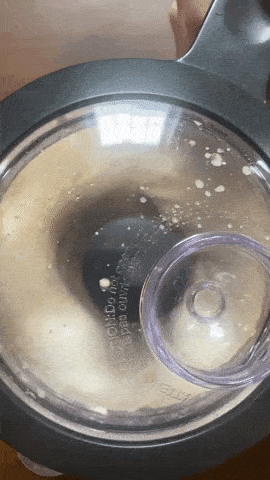 A gif of ingredients blending in a food processor