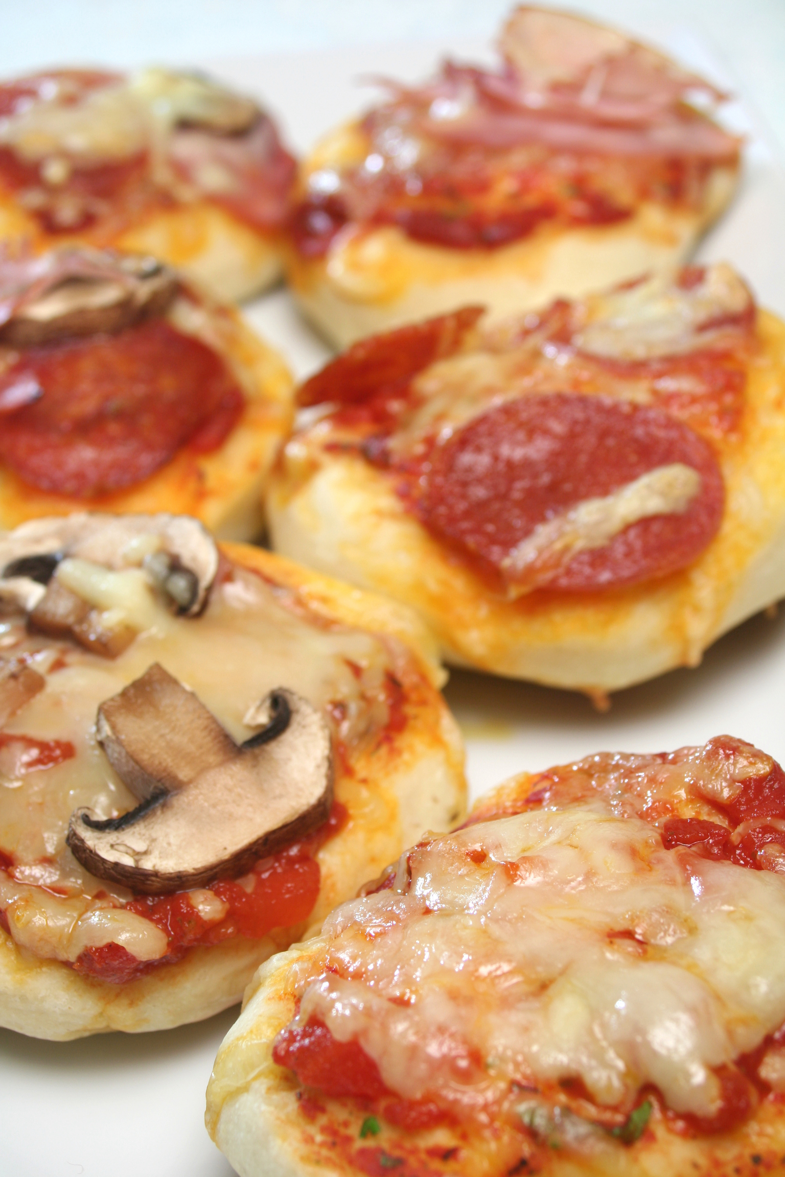 closeup of different mini pizzas