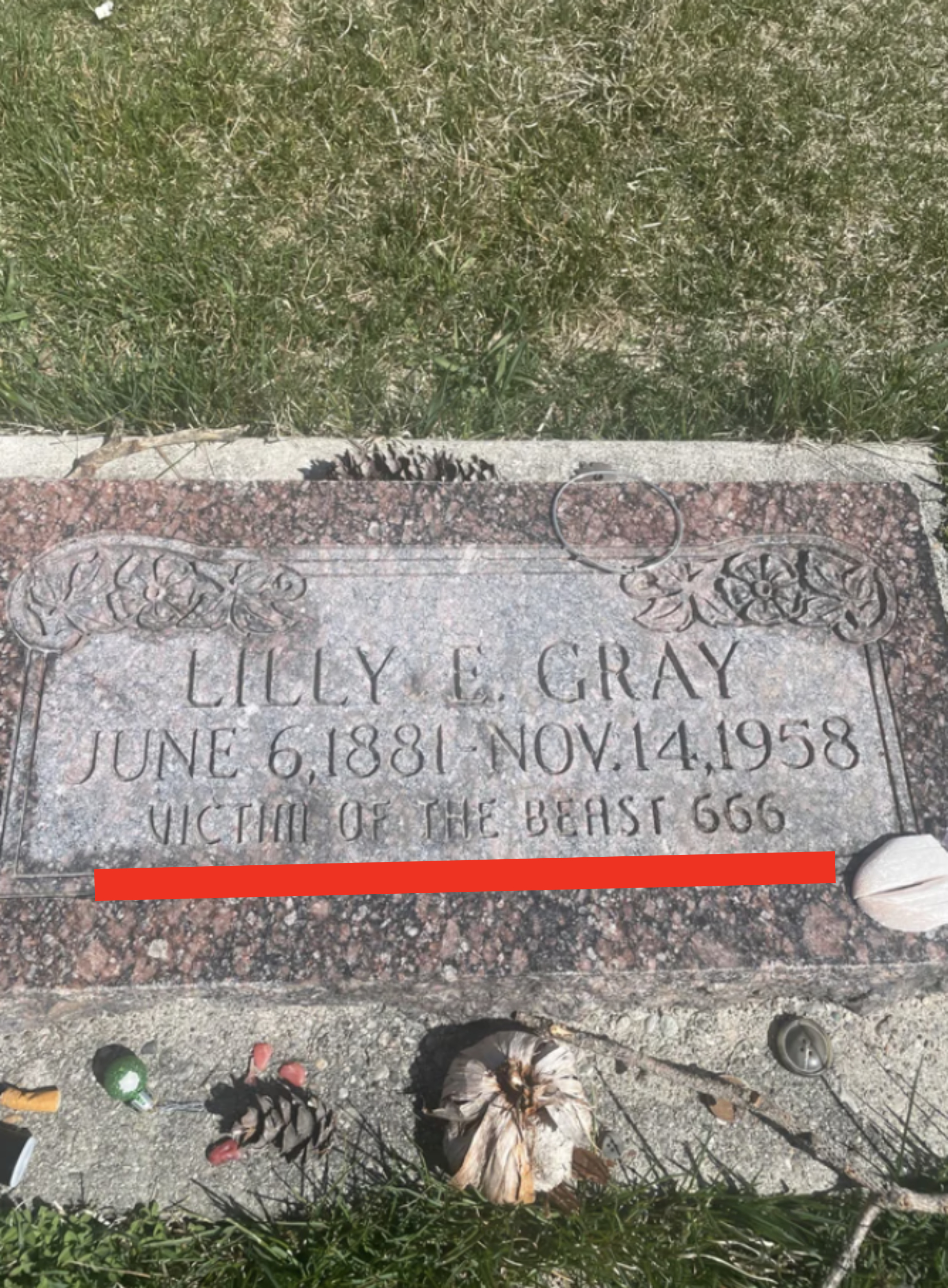 &quot;Lilly E. Gray, June 6, 1881–Nov 14, 1958 / Victim of the Beast 666&quot;