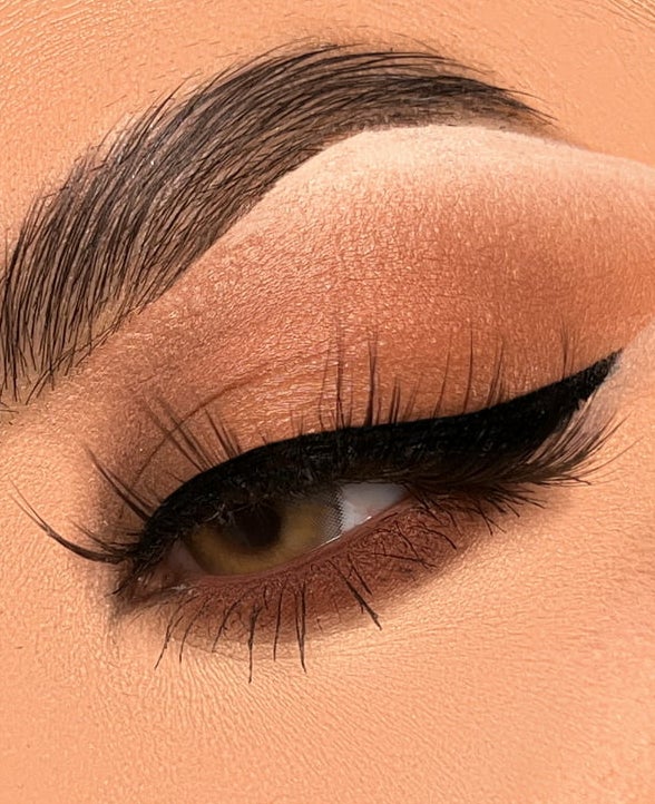 model wearing black liquid eyeliner