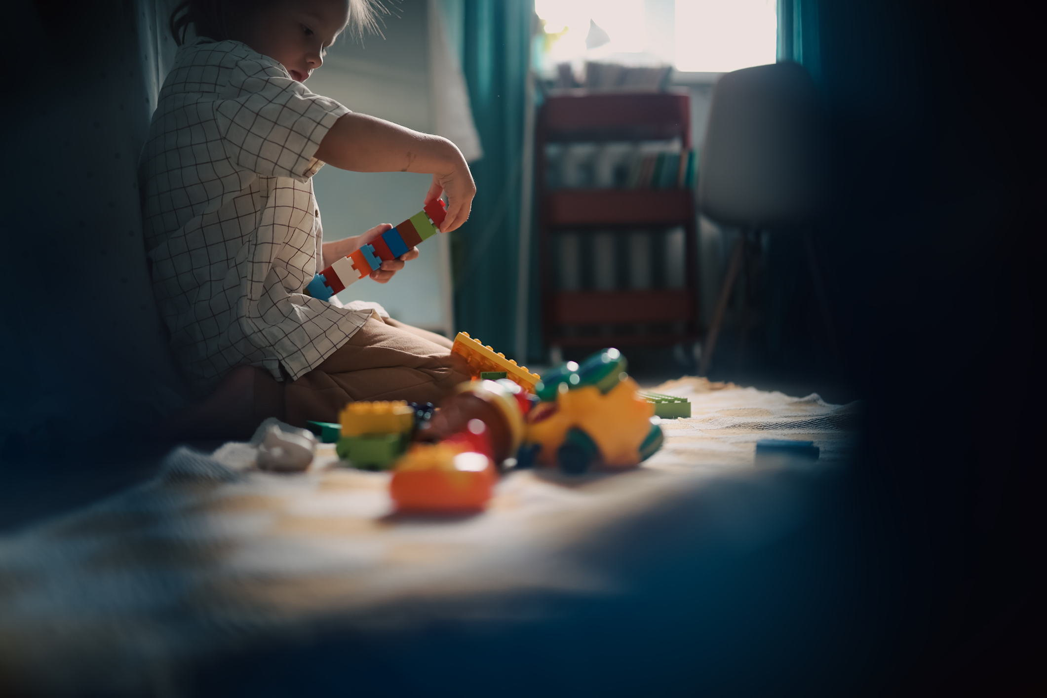 kid playing with toys